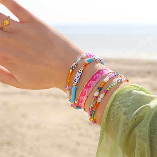 Inspiration for bracelets with acrylic beads, faceted beads and ribbon with text