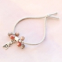 Elastic bracelets and layered necklaces with metal charms