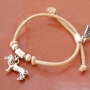 Elastic bracelets and layered necklaces with metal charms