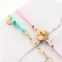 Need some inspiration? It's easy to make trendy bracelets out of elastic cord:
