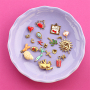 Create playful necklaces with stainless steel charms and letters