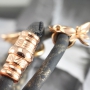 Nice stitched leather with beautiful findings and charms made of Designer Quality metal!